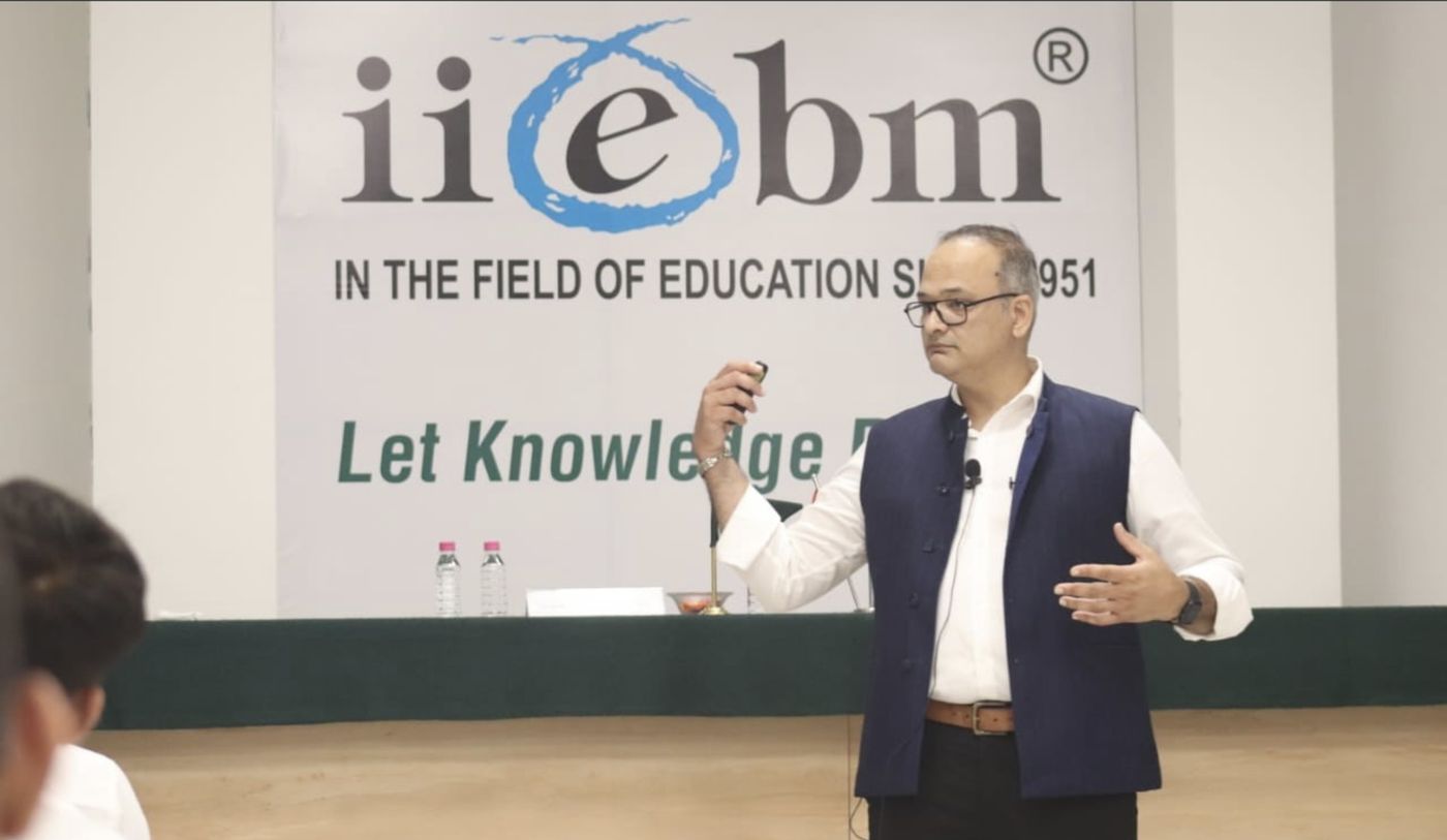 Dr. Vivek S. presenting at a college event