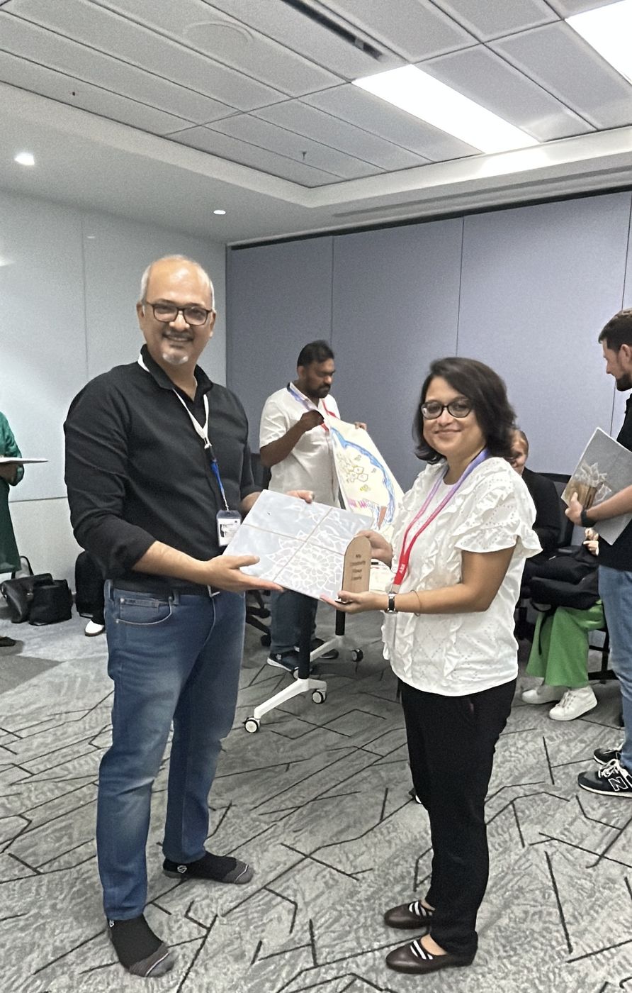 Dr. Vivek S. presenting a certificate to a programme participant